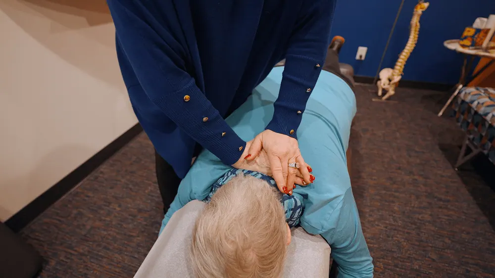 Close-up of an upper back chiropractic adjustment