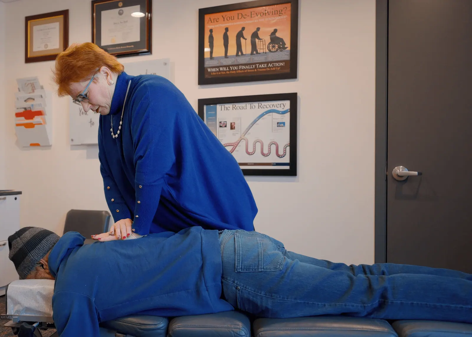 Dr. Trish Wolff adjusting a patient's lower back